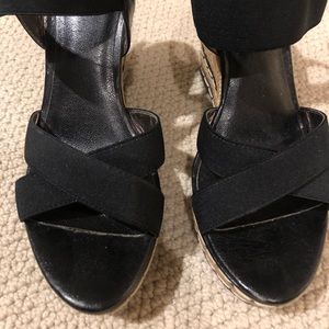 Wedge black sandals.